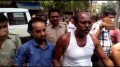 Accused Sankar Biswas and Kamal Majumder being taken to court in Ranaghat. Picture by Tito Chakraborty