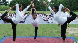 Students of Kalyani University performing yoga at University's sports ground on the occasion of World Yoga Day