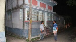 Two civic volunteers on vigil in front of house of a Trinamul councilor in Santipur