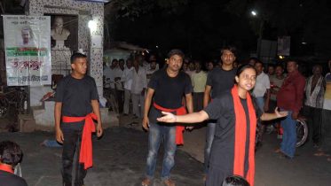 Krishnanagar Sinchan theatre group members performing street play 'Taharush' on Karimpur road near Ghurni. Picture by Pranab Debnath