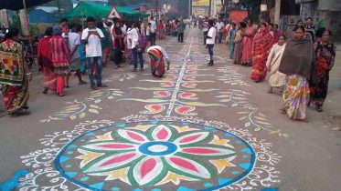 A long stretch of street alpona near Phulia bus stand on Sunday morning. Picture by Sovon Chaudhuri
