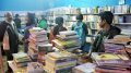 Book lovers in a stall at the venue of the fair