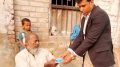 Kaliganj BDO Nazir Hossain handing over Swasthya Sathi card