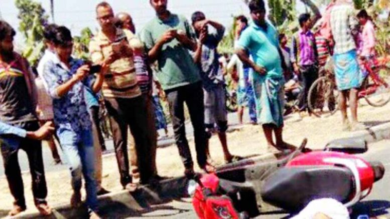 The scooter which the victims were riding lying on NH34