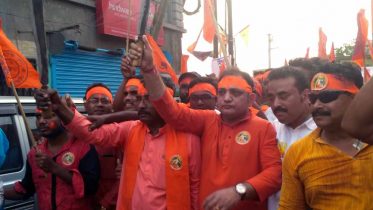 BJP state secretary Raju Banerjee walking in Ram Navami rally in Ranaghat displaying arms