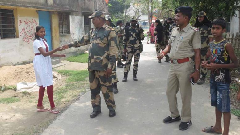 Central Force personnel distributing chocolates