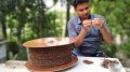 Anupam weaving string of apple seeds