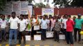 Drivers demonstrate in front of the main entrance of Indian Oil's Kalyani plant