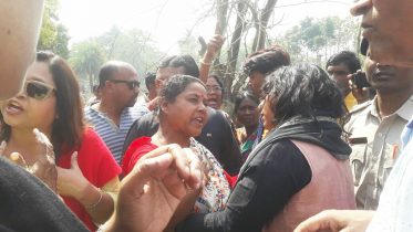 Protesters trying to convince people against filling of pond
