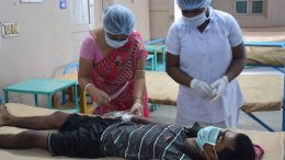 Asit Sarkar being examined by medical staff